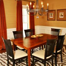 Traditional Gold Dining Room With Zebra-Patterned Rug