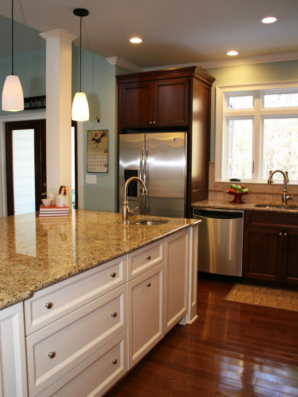 Traditional Kitchen With Large White Island and Dark Wood Wall Cabinets