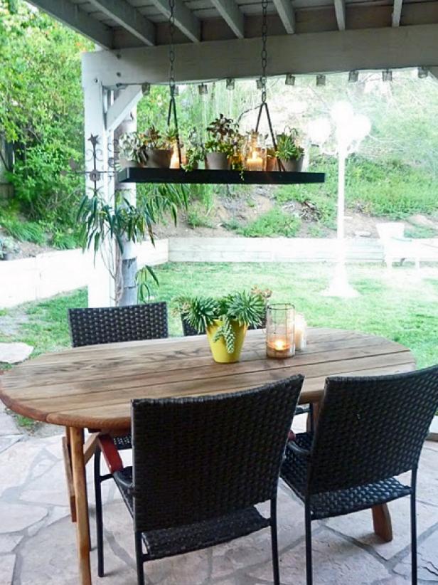 When your pot rack just doesn't seem to suit the kitchen anymore, take it outdoors. Blogger Erin Lepperd revamped a hanging pot rack in her outdoor space by arranging potted plants, succulents and tea lights inside Mason jars. Suspended over her dining table, the new &quot;chandelier&quot; is whimsical, organic and perfect for alfresco.
