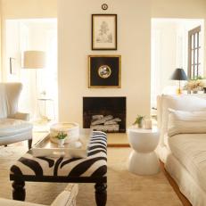 Transitional White Living Room with Dramatic Fireplace and Black Accents