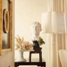 White and Gold Living Room With Classical Bust