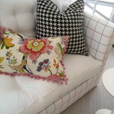 White Sofa With Mix of Patterned Pillows