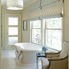 Relaxing White Bathroom With a Freestanding Bathtub