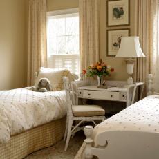 Neutral Child's Bedroom With Polka-Dotted Twin Beds