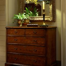 Entryway With Antique Wood Chest and Brass Lamp