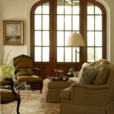 Arching Wood and Glass Door in Traditional Living Room