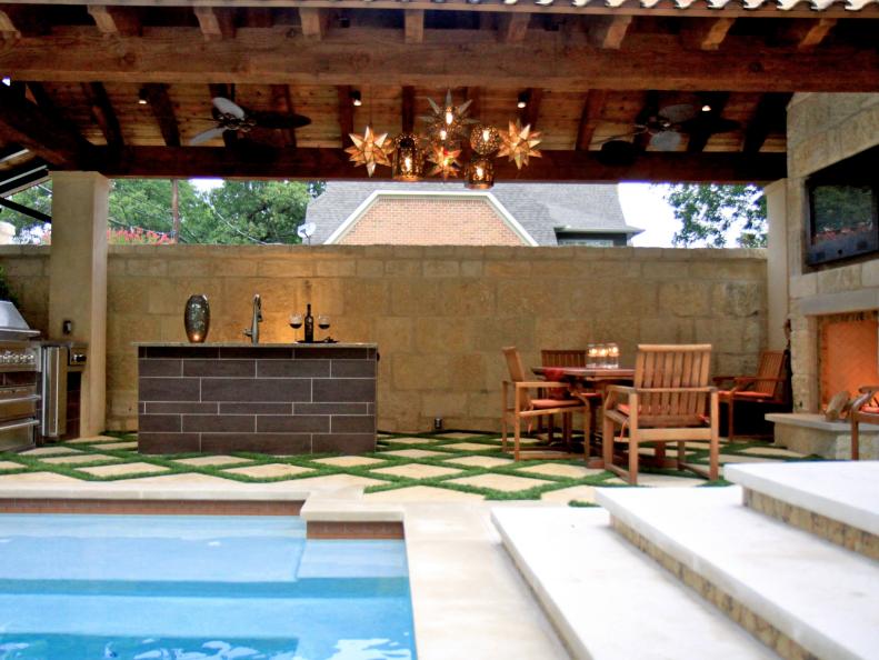 Swimming Pool Adjacent Outdoor Kitchen With Fireplace