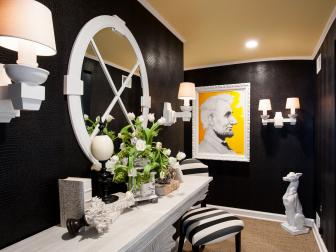 Entryway With Black Walls, White Console Table and Abraham Lincoln Art