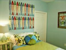 Blue Bedroom With Wooden Fish Wall Art Above Bed