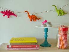 Neon Dinosaur Garland Decorates and Accents Wall in Kid's Room 