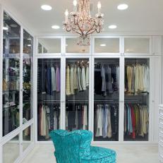 Dreamy Walk-in Closet With Turquoise Chair