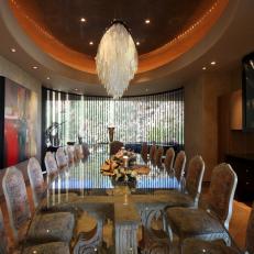 Large Luxury Dining Room With Glass Table and Crystal Chandelier