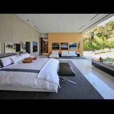 Luxurious Contemporary Master Bedroom Suite With Wall of Windows