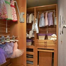 Walk-In Closet Features Folding Clothes Rods