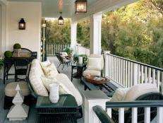 Front Porch With Black and White Railing and Lantern Lights