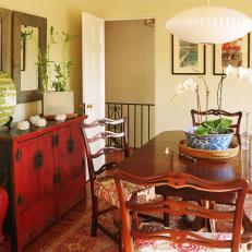 Asian-Inspired Dining Room With Red Credenza