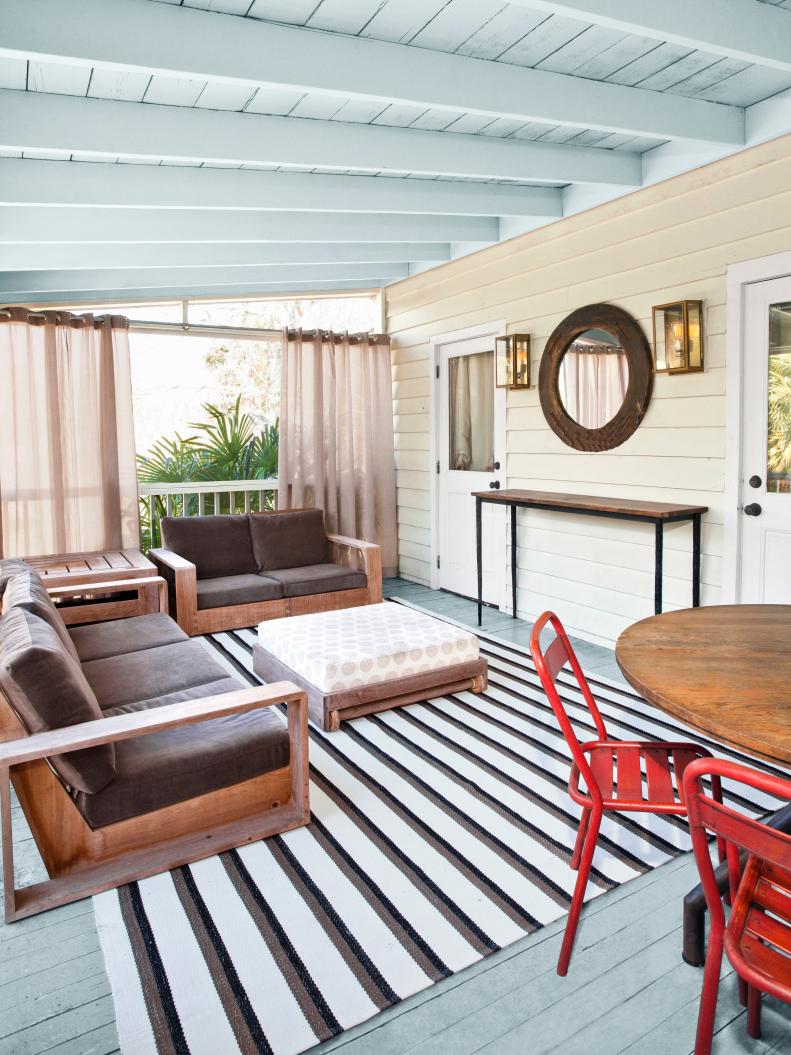 Neutral Porch With Brown Cushions, Pale Blue Ceiling and Red Chairs