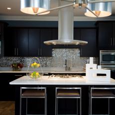 Black Contemporary Kitchen With Stainless Steel Mosaic Backsplash