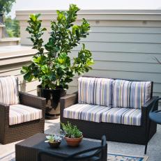 Transitional Rooftop Patio With Brown Wicker Furniture
