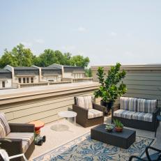 Urban Rooftop Patio With Wicker Furniture
