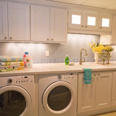 Large Blue Transitional Laundry Room With White Cabinets