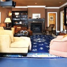 Traditional Brown Living Room With Blue Rug and Fireplace