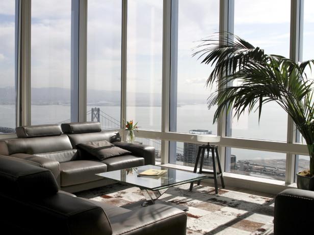 Modern Sitting Area With Black Leather Sofas and Bay View