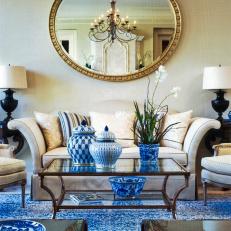 Blue Living Room With Large Round Mirror