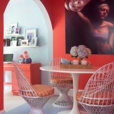 Coral Breakfast Nook With Contemporary Art and Globe Pendant Lights
