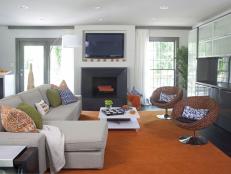 Modern White Living Room With Orange, Blue and Green Accents
