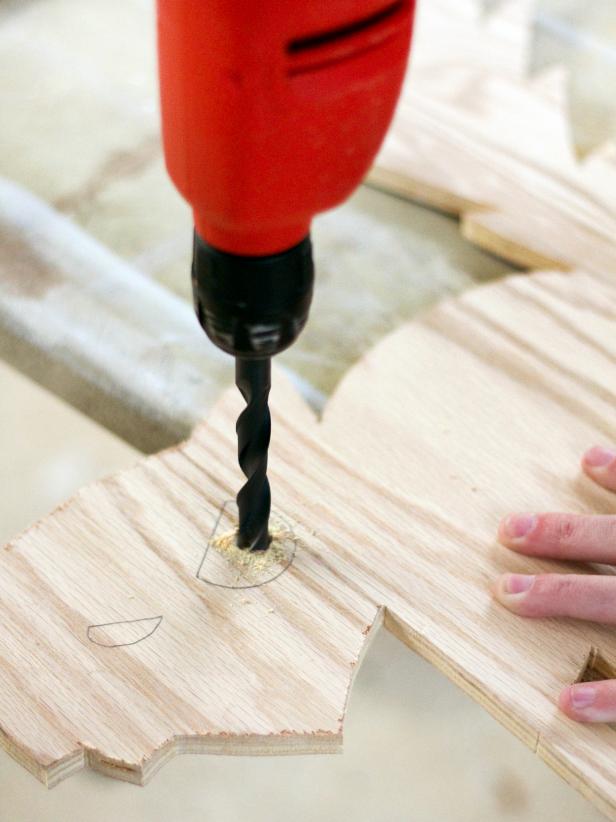 Create starter holes in the center of each eye using an extra-large drill bit.