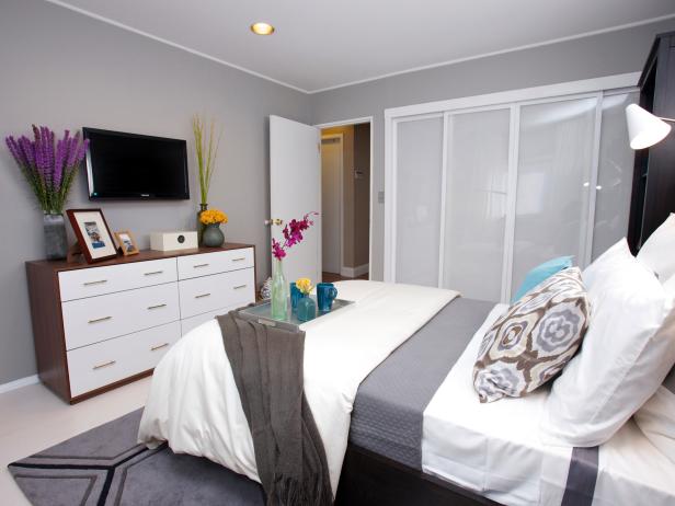 Gray And White Master Bedroom With Wall Mounted Tv Hgtv