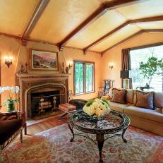 Yellow Living Room With Vaulted Ceiling and Old World Charm