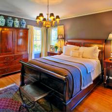 Traditional Bedroom With Sleigh Bed and Chandelier