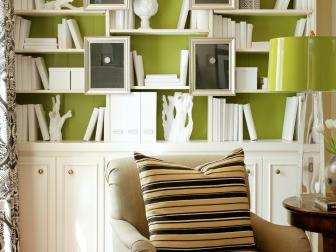 Transitional Sitting Area in Library With White and Green Built-In Shelf