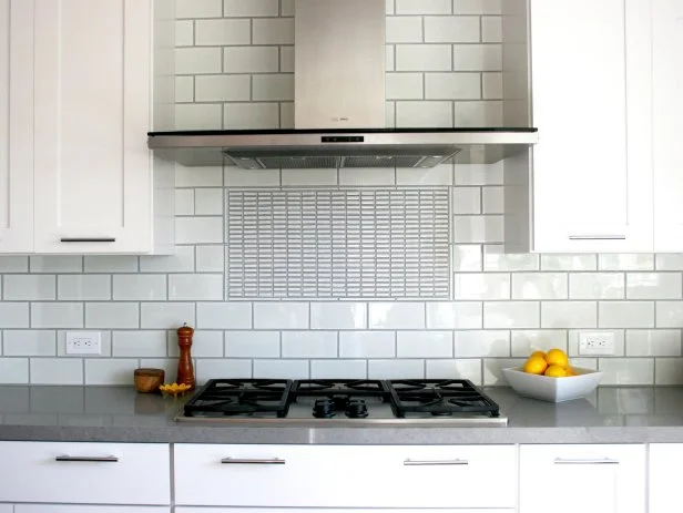 Built-In Stainless Steel Range and Hood With Subway-Tile Backsplash