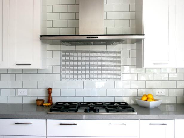 Built-In Stainless Steel Range and Hood With Subway-Tile Backsplash