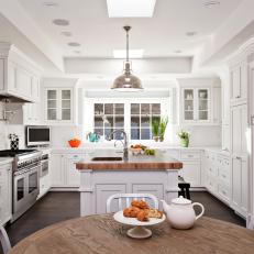 Transitional White Kitchen With Butcher Block Island