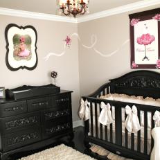 Girl's Nursery With Ornate Black Furniture