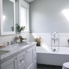 Gray Bathroom With White Wainscoting 