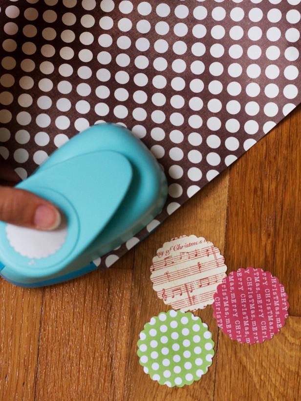 Use a large, scallop-edge paper punch to cut seven circles out of different patterns of card stock.