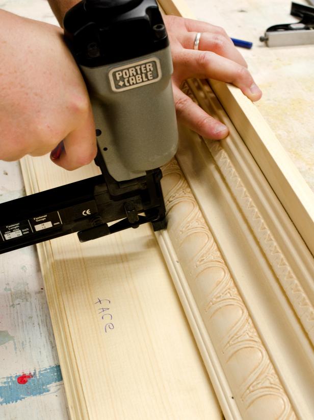Using a brad nailer or hammer with 3/4-inch brad nails, attach molding to face or back of shelf. Make sure molding is at proper angle and centered on shelf. Put return pieces in while nailing molding to ensure tight fit.