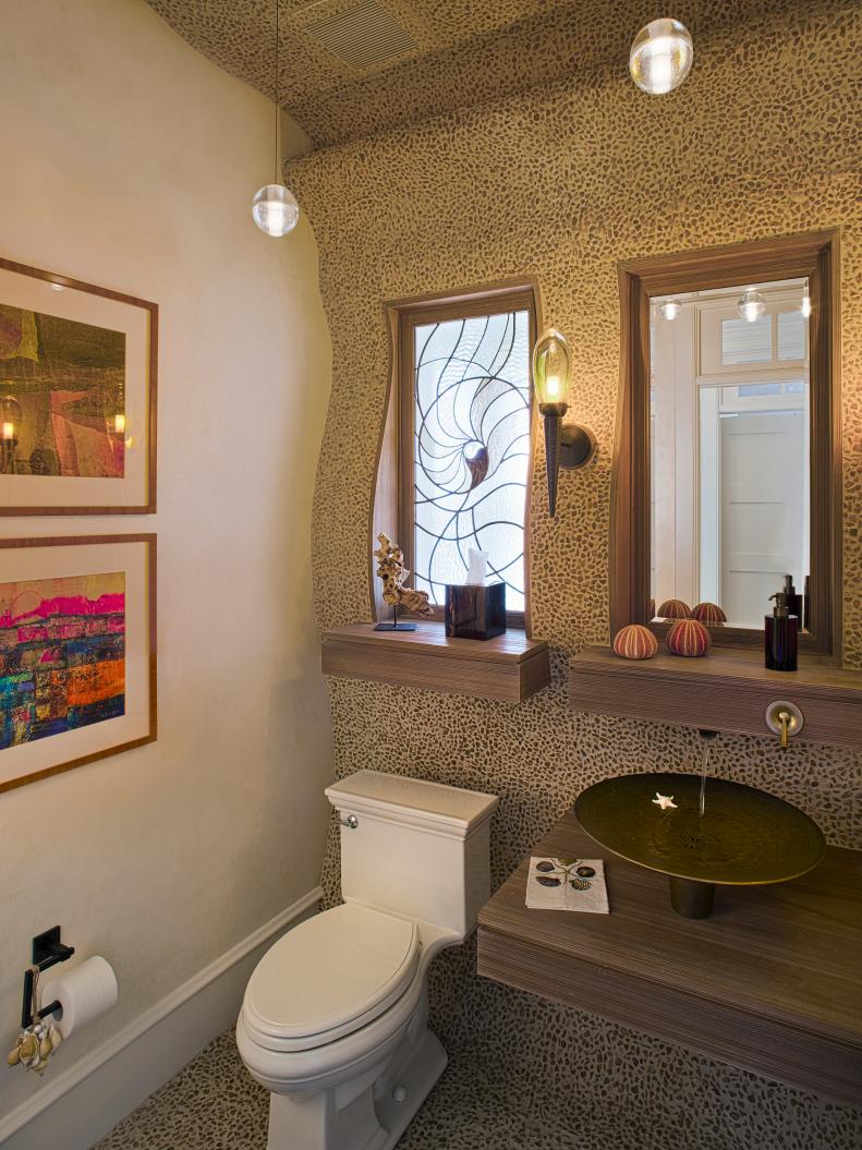 Neutral Bathroom With Curved Pebble Walls, Floating Vanity and Mirror