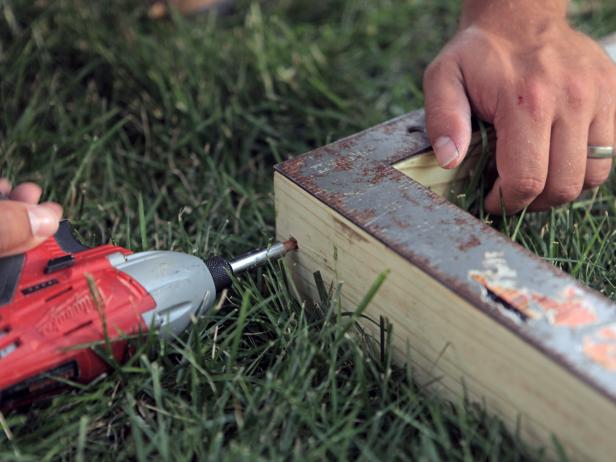 Using 3-inch exterior screws or nails, fasten all outside frame pieces together with a drill or nail gun.
