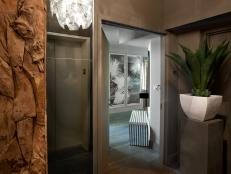 Entry Hall With Elevator, Driftwood Accents and Large Tropical Plant