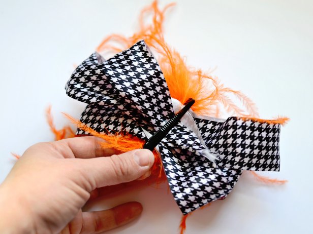 Use a feathered hair clip to hold bow in place and attach to wreath.