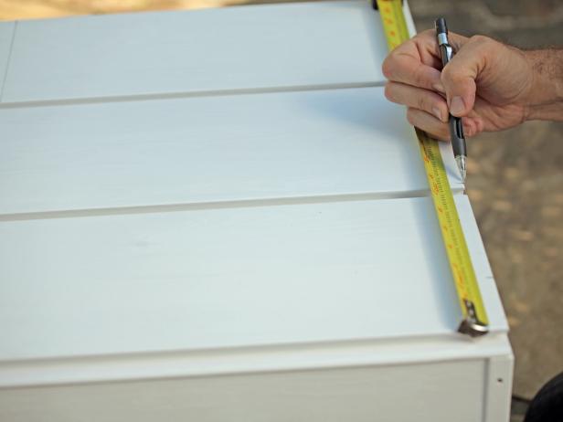 When choosing chests of drawers to give a chevron makeover, stick with styles that have smooth, flat drawer fronts. Using an electric sander, sanding pads and an extension cord, remove existing finishes from stained or painted wood. In order to ensure the best finish, add two coats of either primer or a base color to the chest of drawers using a paint roller. Then sketch your design with a carpenter’s pencil. Outline your design with painter’s tape, and then apply colorful paint. Repeat until all chevrons have been painted. Seal drawer fronts with s coat of sealant.