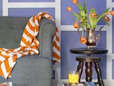 Purple Living Room with White Wainscoting and Orange Accents
