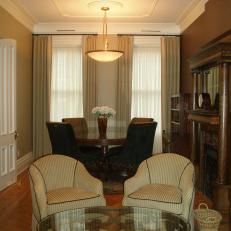 Warm Parlor and Sitting Area With Pendant Light and Elegant Molding