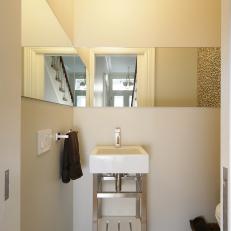 Small Bathroom With Mirror and Tile Elements 